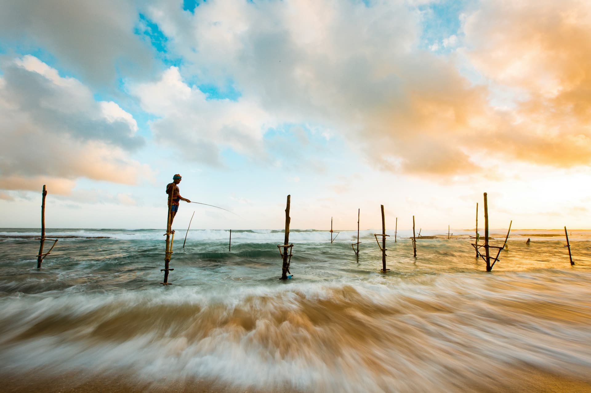 Lagoon House — private jetty at dawn with fishing boats