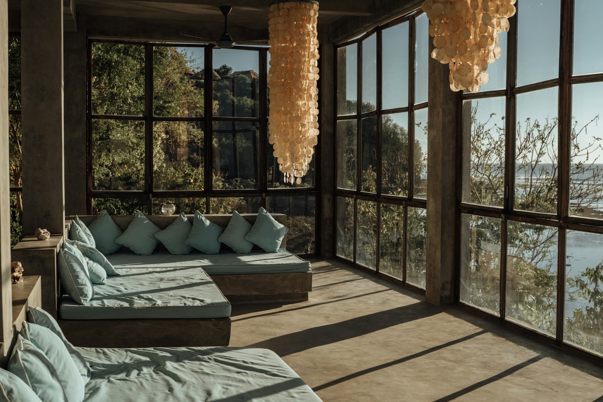 Villa Serendib — light-filled lounge behind colonial glass doors